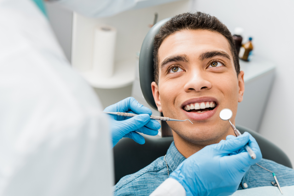 patient getting a dental cleaning and exam at a dentist near you